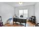 Office featuring a traditional desk, leather chair, and electric guitar at 868 Cork Oak Ln, Lawrenceville, GA 30045