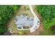 Overhead view of a lovely home nestled in lush greenery, showcasing a well-kept roof, landscaped yard, and private driveway at 4002 Turnstone Nw Dr, Kennesaw, GA 30152
