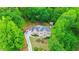 Beautiful home nestled among lush trees with a long driveway and well-kept lawn, offering privacy at 4002 Turnstone Nw Dr, Kennesaw, GA 30152