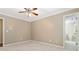 Neutral bedroom features a ceiling fan, carpeted floor, and access to the en suite bathroom at 4002 Turnstone Nw Dr, Kennesaw, GA 30152