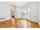 Elegant dining room with hardwood floors, shuttered windows, and modern lighting fixtures at 4002 Turnstone Nw Dr, Kennesaw, GA 30152