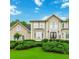 Elegant home with a manicured lawn, complemented by tasteful landscaping and an inviting entrance at 4002 Turnstone Nw Dr, Kennesaw, GA 30152