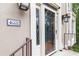 Welcoming entryway showcasing a decorative address tile, classic lighting, and a beautifully crafted glass door at 4002 Turnstone Nw Dr, Kennesaw, GA 30152