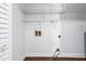 Laundry room area features wall-mounted shelving and exposed hookups at 4002 Turnstone Nw Dr, Kennesaw, GA 30152