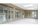 Bright sunroom featuring tile floor, white shutters, and many windows at 4002 Turnstone Nw Dr, Kennesaw, GA 30152