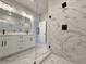 Bathroom featuring glass shower, double sinks, and marble accents at 5706 Urban Village Way # 4, Tucker, GA 30084