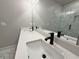 Bathroom featuring double sinks, and quartz countertops, and a glass shower at 5706 Urban Village Way # 4, Tucker, GA 30084
