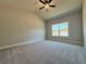 Spacious bedroom features vaulted ceiling, carpet, neutral paint, and window with great light at 5706 Urban Village Way # 4, Tucker, GA 30084