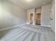 Bright bedroom includes plush carpeting, neutral walls, and easy bathroom access at 5706 Urban Village Way # 4, Tucker, GA 30084