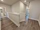 Bright hallway with durable floors, white trim, and easy access to the bedrooms at 5706 Urban Village Way # 4, Tucker, GA 30084
