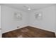 Bright bedroom with hardwood floors, neutral walls, and windows offering natural light at 1142 Palafox Ne Dr, Atlanta, GA 30324