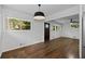 Spacious dining area with hardwood floors, ample natural light, and a view into the living room at 1142 Palafox Ne Dr, Atlanta, GA 30324