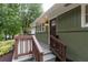 Inviting front porch with stylish railings, complementing the home's exterior and garden at 1142 Palafox Ne Dr, Atlanta, GA 30324