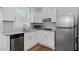Well-equipped kitchen boasts stainless steel appliances, granite countertops, and ample cabinet space at 1142 Palafox Ne Dr, Atlanta, GA 30324