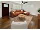 Bright living room featuring hardwood floors, ample natural light, and stylish furnishings at 1142 Palafox Ne Dr, Atlanta, GA 30324
