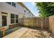 Small backyard has a wooden fence and a concrete patio at 2249 Knoxhill Se Vw, Smyrna, GA 30082