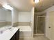 A bright bathroom has a soaking tub and a glass shower at 2249 Knoxhill Se Vw, Smyrna, GA 30082