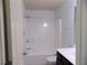 Bright bathroom featuring a shower-tub combo and modern fixtures at 2249 Knoxhill Se Vw, Smyrna, GA 30082