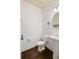 Half bath with modern fixtures, pedestal sink, and hardwood floors at 2249 Knoxhill Se Vw, Smyrna, GA 30082