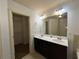 Bright bathroom featuring a double sink vanity and walk-in closet for ample storage space at 2249 Knoxhill Se Vw, Smyrna, GA 30082