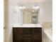 Bathroom with double sink vanity, bathtub, and tile surround at 2249 Knoxhill Se Vw, Smyrna, GA 30082