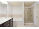 Bright bathroom featuring a tub, stand-up shower, and tile at 2249 Knoxhill Se Vw, Smyrna, GA 30082