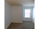Neutral bedroom with carpet flooring and a large window offering plenty of natural light at 2249 Knoxhill Se Vw, Smyrna, GA 30082