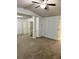A large bedroom featuring neutral carpets, paint and doors, and a ceiling fan at 2249 Knoxhill Se Vw, Smyrna, GA 30082