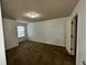 Spacious carpeted bedroom with a window providing natural light at 2249 Knoxhill Se Vw, Smyrna, GA 30082