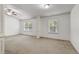 Large bedroom featuring a ceiling fan and windows for natural light at 2249 Knoxhill Se Vw, Smyrna, GA 30082