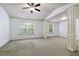 Large bedroom featuring a ceiling fan and windows for natural light at 2249 Knoxhill Se Vw, Smyrna, GA 30082