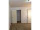 Bedroom featuring neutral carpeting, closet, and two white doors to other rooms at 2249 Knoxhill Se Vw, Smyrna, GA 30082
