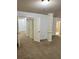 Large bedroom featuring neutral carpets, paint, and doors, creating a calming atmosphere at 2249 Knoxhill Se Vw, Smyrna, GA 30082