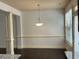 Dining area featuring a chandelier, large window, and decorative molding at 2249 Knoxhill Se Vw, Smyrna, GA 30082