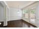 Bright dining room featuring hardwood floors, a chandelier, and a door to the outside at 2249 Knoxhill Se Vw, Smyrna, GA 30082