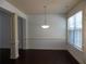 Traditional dining room featuring hardwood floors, neutral walls and a decorative chandelier at 2249 Knoxhill Se Vw, Smyrna, GA 30082