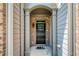 Arched front entryway featuring a black door with glass and brick accent at 2249 Knoxhill Se Vw, Smyrna, GA 30082