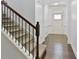 Inviting entryway with hardwood floors, stairs and bright white walls and trim at 2249 Knoxhill Se Vw, Smyrna, GA 30082