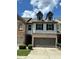 Charming townhome with a two-car garage and manicured landscaping at 2249 Knoxhill Se Vw, Smyrna, GA 30082