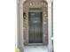 A gray front door with the house number 2249 between two white columns on a brick house at 2249 Knoxhill Se Vw, Smyrna, GA 30082