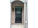 Inviting front door with brick surround, sidelights, and address numbers at 2249 Knoxhill Se Vw, Smyrna, GA 30082