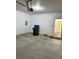 Clean and spacious two car garage featuring white walls and sealed concrete floor at 2249 Knoxhill Se Vw, Smyrna, GA 30082