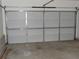 Spacious garage with a light-colored door, providing secure parking and storage space at 2249 Knoxhill Se Vw, Smyrna, GA 30082