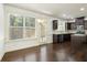 Bright kitchen featuring dark cabinets, stainless steel appliances, granite counters and hardwood floors at 2249 Knoxhill Se Vw, Smyrna, GA 30082