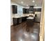 Well-equipped kitchen featuring an island, stainless steel appliances and dark wood floors at 2249 Knoxhill Se Vw, Smyrna, GA 30082