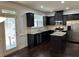Kitchen with stainless appliances, granite countertops, dark cabinets and hardwood floors at 2249 Knoxhill Se Vw, Smyrna, GA 30082