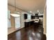 Modern kitchen features stainless steel appliances, dark cabinets, and a center island at 2249 Knoxhill Se Vw, Smyrna, GA 30082