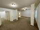 Spacious living room with carpeting, multiple windows, and a ceiling fan at 2249 Knoxhill Se Vw, Smyrna, GA 30082