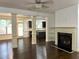 Living room with columns, hardwood floors, and fireplace at 2249 Knoxhill Se Vw, Smyrna, GA 30082