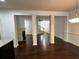 Spacious living area with hardwood floors, fireplace, and open view to kitchen at 2249 Knoxhill Se Vw, Smyrna, GA 30082